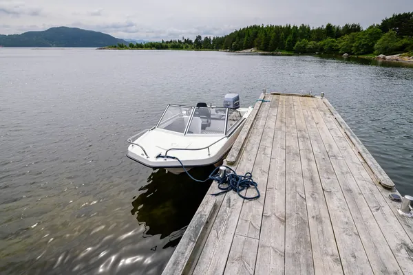 Trifoil 100GT moored alongside a wooden jetty